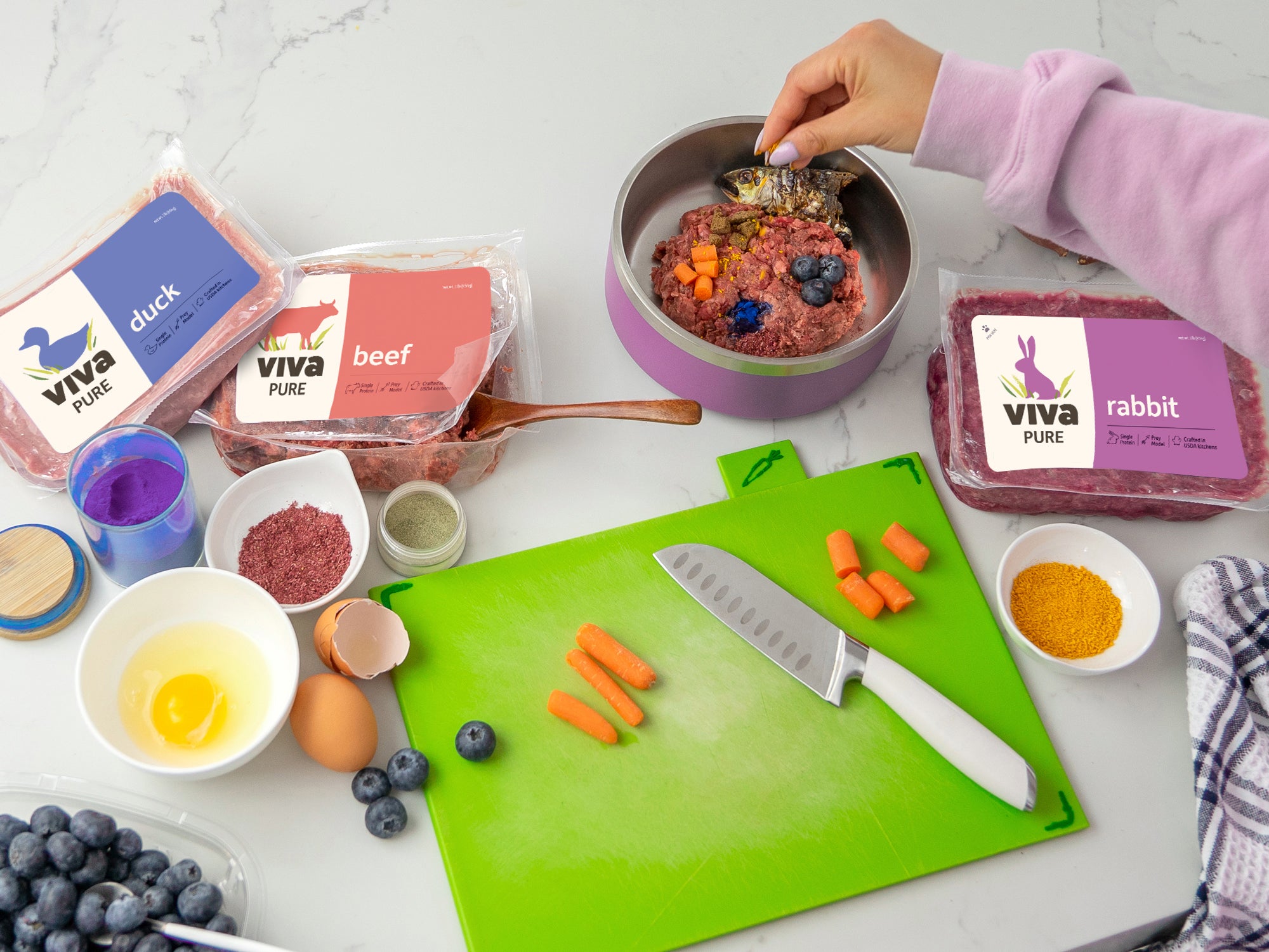 A flatlay of a Viva meal prep, with fruits,eggs, and vegetables