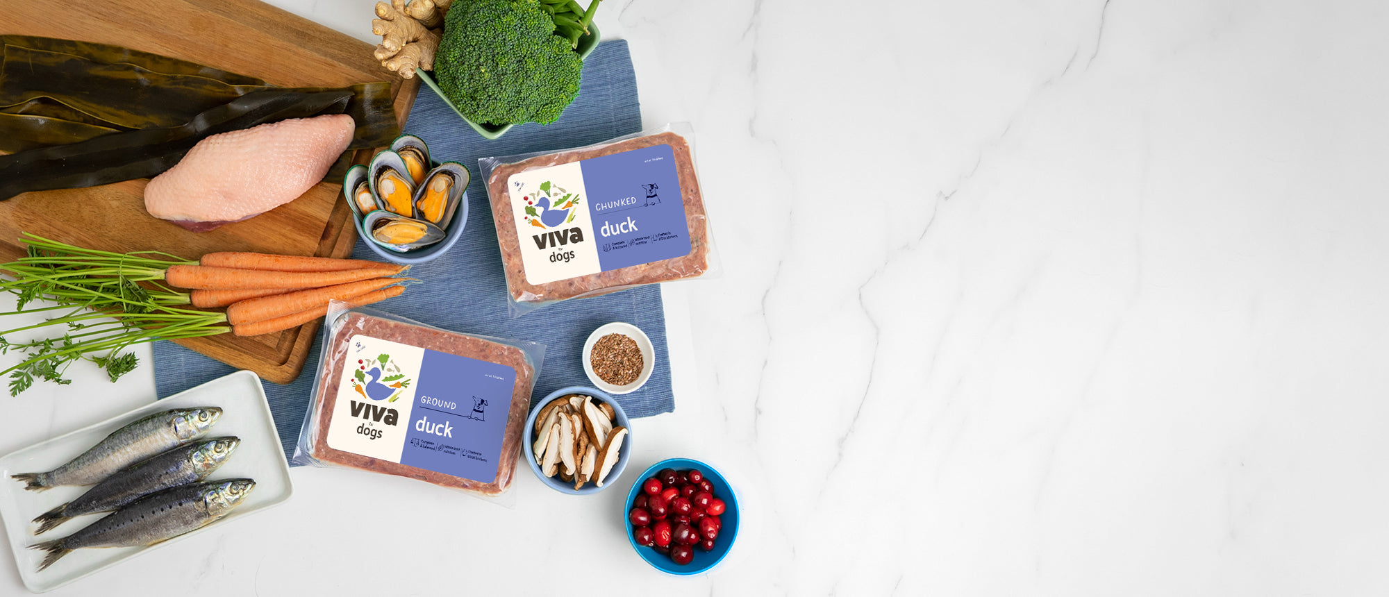 A flatlay of a Viva’s Duck for Dogs, with the key ingredients used for the recipe